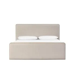 Pierce Bed with beige upholstered headboard and footboard, aged solid oak frame with rounded corners