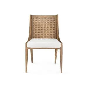 Front view highlighting square white cushion and woven cane backrest on Raleigh Armchair