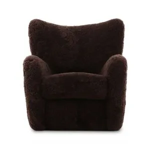 Amelie Chair with richly textured dark brown shearling upholstery, softly curved back and sculpted arms