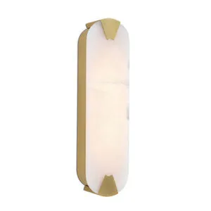 Houston Linear Sconce with elongated natural alabaster slab and brass-finished metal frame casting warm diffused light