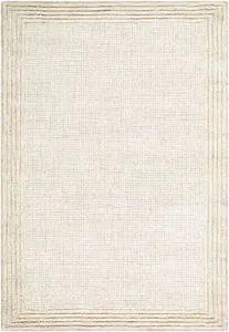 Ivory and sandstone rectangular handmade wool rug with a subtle textured border and medium pile