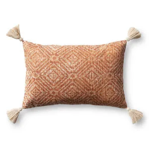 Rectangular orange pillow with white geometric pattern and tassels at each corner