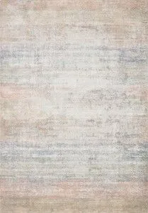 Lucia Mist Rug with a vintage style, featuring a subtle blend of beige, blue, and soft pink hues in a high-low pile texture.
