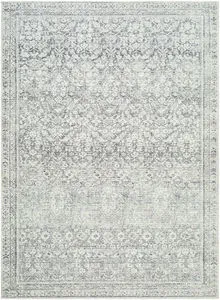 Charcoal machine woven rug with intricate vintage floral motif in subdued gray and cream tones