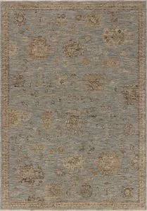 Traditional Turkish style area rug with faded sand and pale sky tones and vintage motifs
