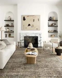 Layla 18" Antique Moss Rug with traditional vintage pattern in muted moss and beige tones in a living room