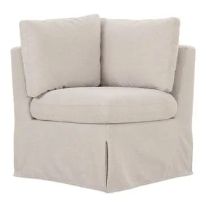 Fable slipcover dining corner banquette with beige washable fabric and inverted pleat skirt