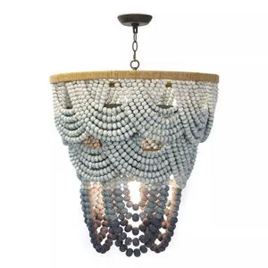 Chandelier with layered ombre wooden beads in blue shades draped on a rattan circular frame, coastal chic style