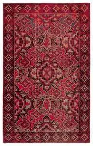Full view of rug showing complete medallion design and decorative border in rich colors