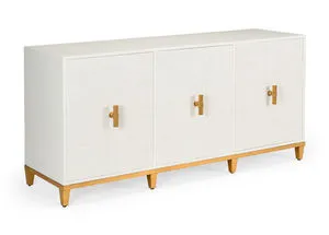 White wooden console with raffia covered doors and gold leaf hardware, raised on gold-finished legs