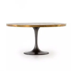 Evans Round Dining Table with a light burnt oak top, polished brass steel band, and vessel grey iron tulip base