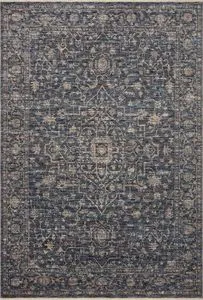 Sorrento Midnight / Natural traditional area rug with intricate faded vintage-style pattern in blue and beige hues