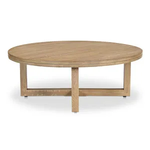 Round Joel coffee table with thick solid oak top featuring V-groove and geometric crisscross base in wire-brushed finish