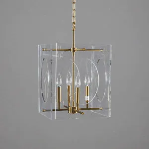 Clear acrylic cube pendant chandelier with round cutouts and brass frame holding 4 bulbs on a chain