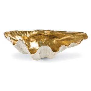Large decorative clam shell bowl with textured white exterior and shiny gold interior