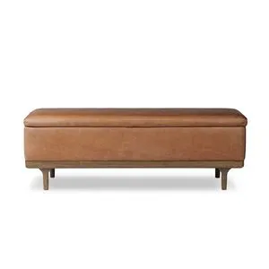Rectangular Iris Trunk with rich tan leather upholstery and oak frame with tapered legs in worn oak finish