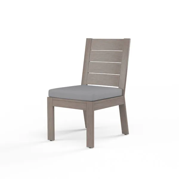 Laguna Armless Dining Chair with hand-brushed aluminum frame mimicking driftwood and gray seat cushion