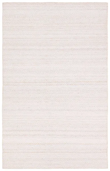 Handwoven outdoor rug with diamond trellis pattern in tan and cream, subtle distressed neutral hues