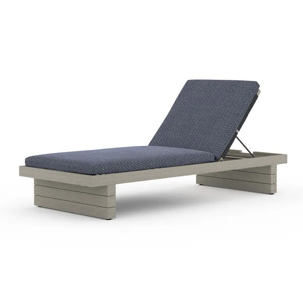 Leroy Outdoor Chaise in weathered grey finish with adjustable backrest and dark blue cushioned seat