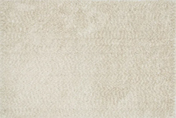 Ivory shag rug with plush, twisted base yarns and longer soft polyester fibers in a rectangular shape