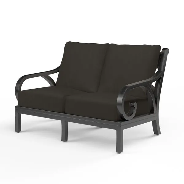 Monterey Loveseat with dark espresso aluminum frame featuring organic curved arms and plush black cushions