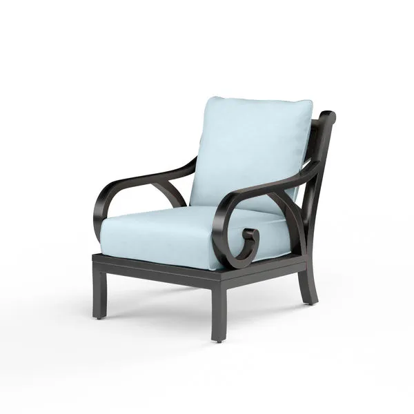 Monterey Club Chair with espresso aluminum frame, Old World Copper Rub finish, and light blue outdoor cushions