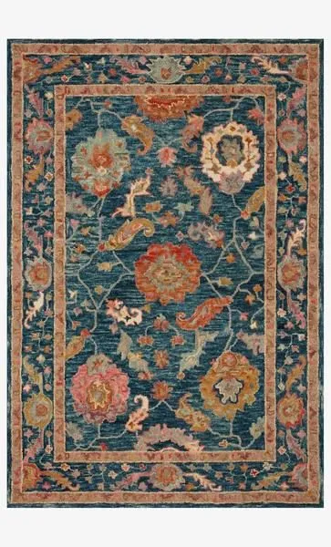 Padma Marine Multi Rug with thick wool pile, asymmetrical floral design on deep blue background, warm multicolor border
