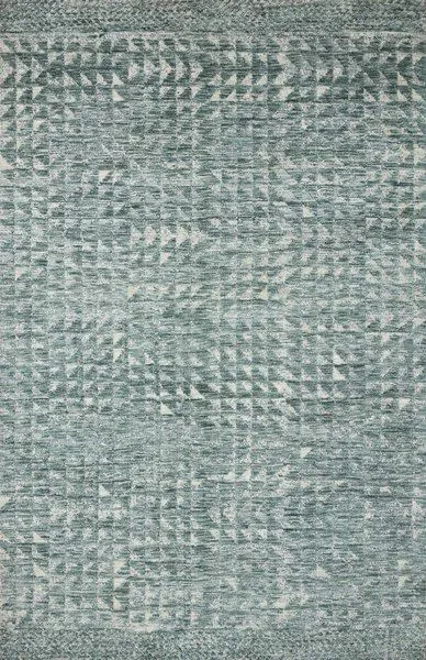 Muted blue-green traditional rug with geometric, architectural pattern and subtle cream accents