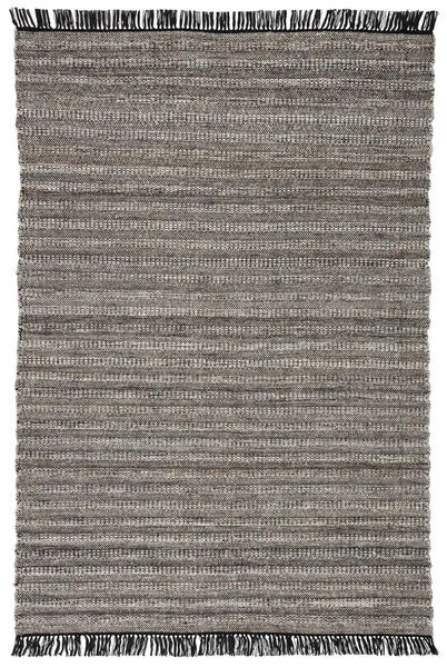 Handwoven indoor/outdoor area rug with black, gray, and rust tan tones, featuring black fringe on short edges.