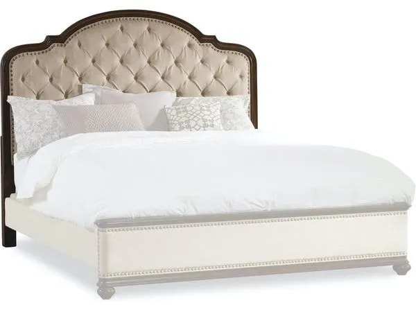 Front view of headboard and matching upholstered bed frame with nailhead trim on plain white background