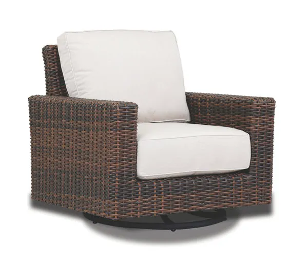 Montecito Swivel Rocker Club Chair with cognac multi-colored resin wicker and white cushions