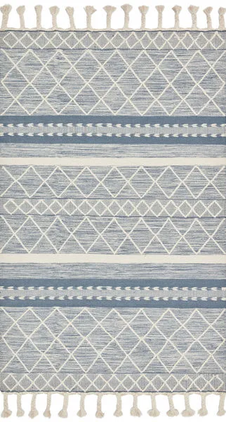 Sawyer Teal Rug with bold, tonal geometric patterns and playful fringe in a blue and cream color palette