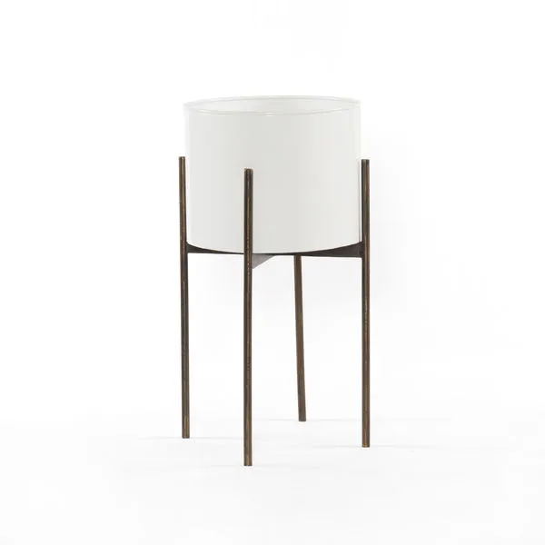 Jed Planter Small with white cylindrical pot elevated on slender dark metal stand with four legs