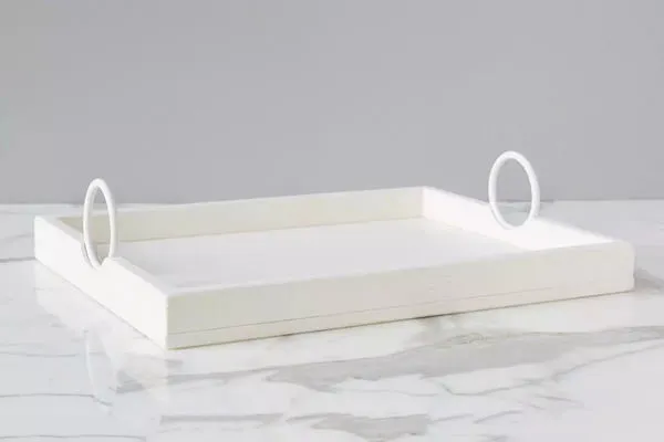 White Bianca Rectangle Tray with sleek rectangular shape, natural wood finish, and round white handles on marble surface