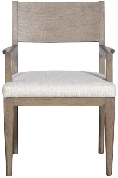 Ridge Dining Arm Chair with light wood frame, structured arms, and light beige upholstered seat cushion