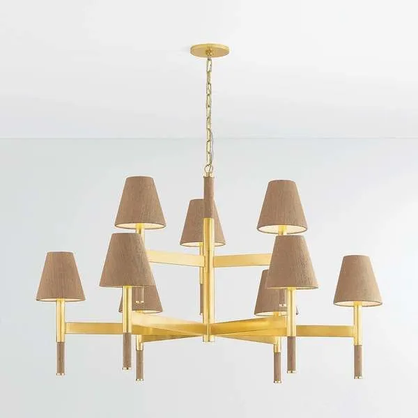 Lindenwood chandelier features aged brass frame with woven grasscloth shades and wrapped stem accents on six arms.