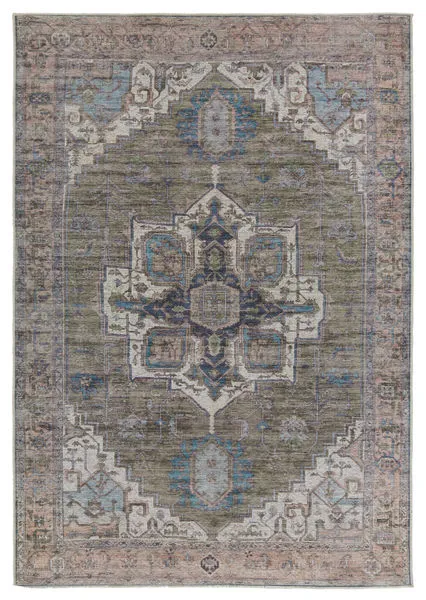 Distressed medallion pattern rug with floral detailing in rich green, blue, cream, pink, brown, and navy tones