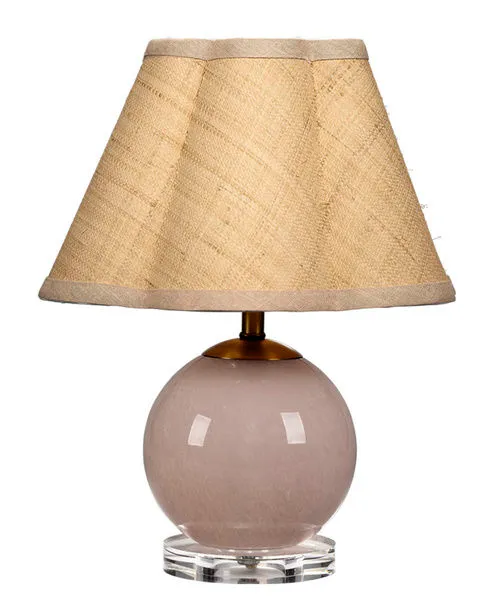 Dottie Table Lamp with a round pink handblown glass base on clear acrylic and a beige woven scalloped shade