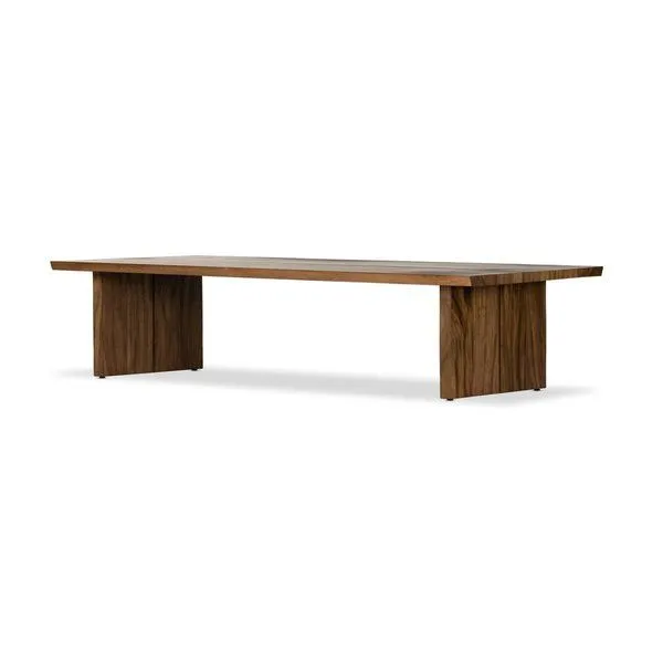 Side angled view showing thick wood top and wide vertical legs of coffee table