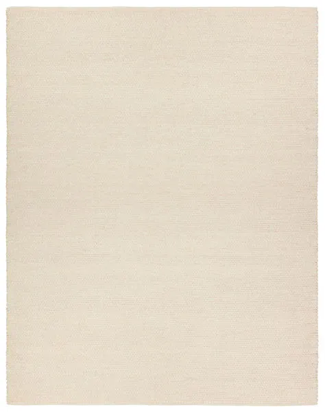 Solid beige handwoven rug with a 1/3 inch high textured weave in a warm neutral tone