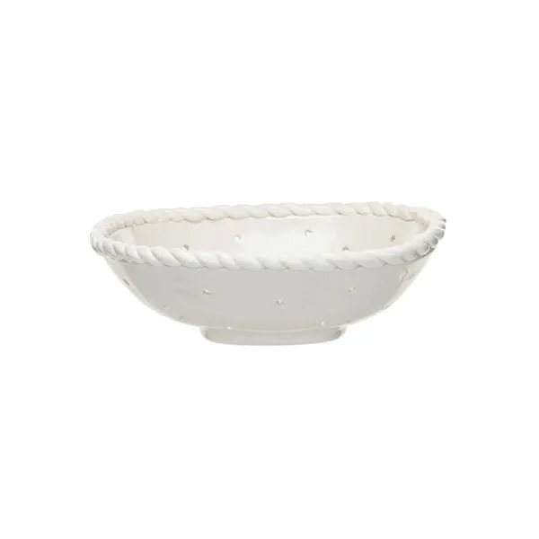 White stoneware colander with hand-twisted edge and evenly spaced drainage holes