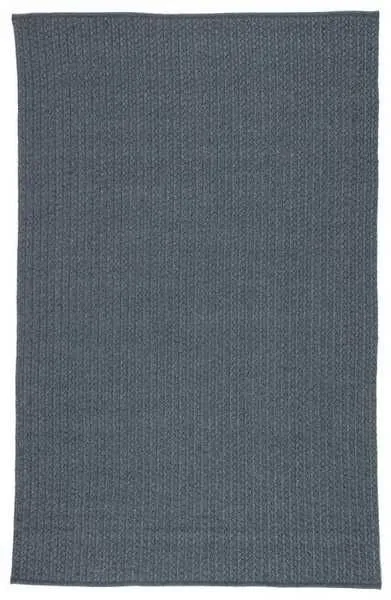 Full view of rectangular solid blue rug showing uniform braided texture and neat edges