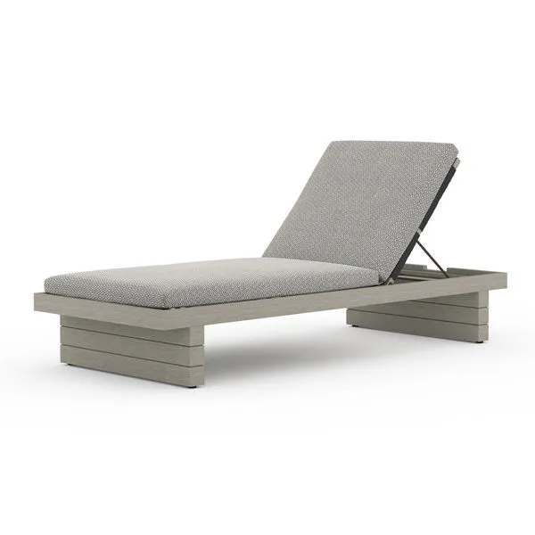 Modern grey outdoor chaise lounge with solid teak frame and stone grey textured cushion, reclined backrest