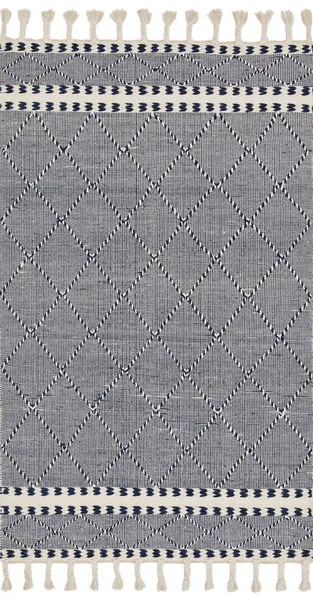 Sawyer navy rug with bold diamond graphic pattern, hand-loomed wool and cotton fibers, finished with playful fringes