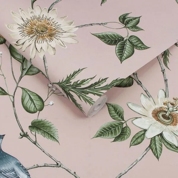 Nuit Blush wallpaper with hand drawn blooming white flowers, delicate blue birds, and green leaves on a soft pink backgrou...