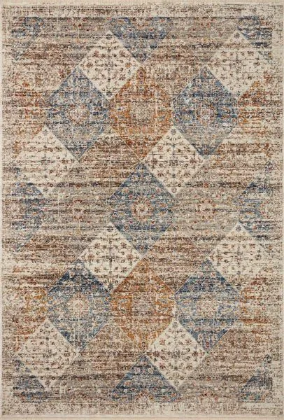 Traditional area rug with warm ivory, blue, and rust geometric and floral patterns with a vintage faded effect