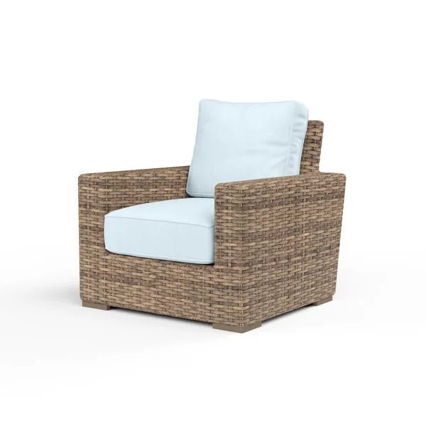 Havana Club Chair outdoor accent chair in rich weathered tobacco wicker with light blue cushions