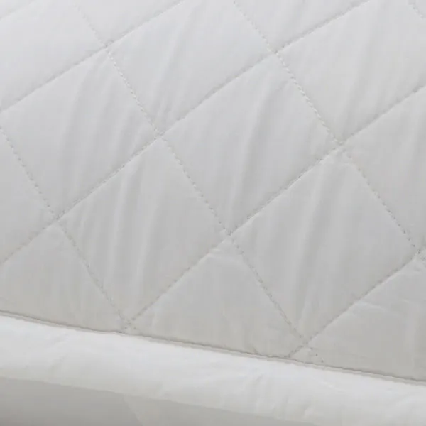 Close-up of quilted diamond stitching and smooth bamboo sateen texture on Monaco coverlet