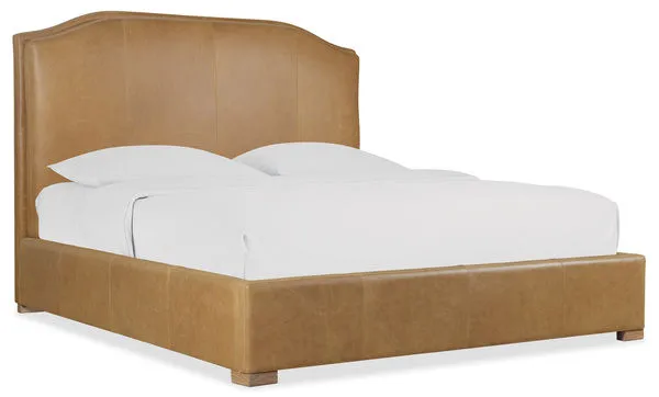 Driftwood California King bed with caramel leather upholstery, simple wood feet, and curved headboard design