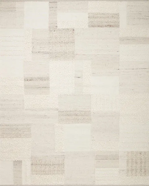 Manfred Ivory Pebble Rug with hand-knotted patchwork design in neutral ivory tones featuring varied high-low textures.